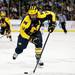Michigan senior center Kevin Lynch skates with the puck in the second period of the game against Michigan State at Joe Louis Arena on Saturday, Feb. 2. Michigan leads 4-2 at the end of the second. Daniel Brenner I AnnArbor.com
